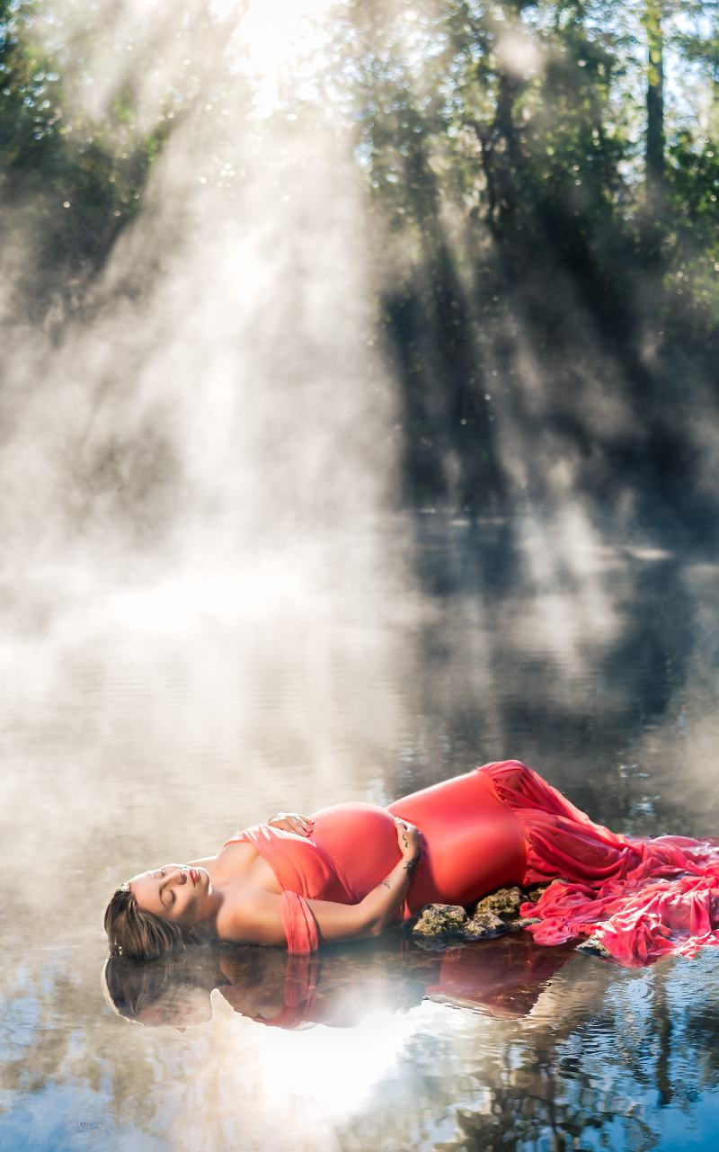 Expecting mother in a flowing maternity gown photographed in Florida