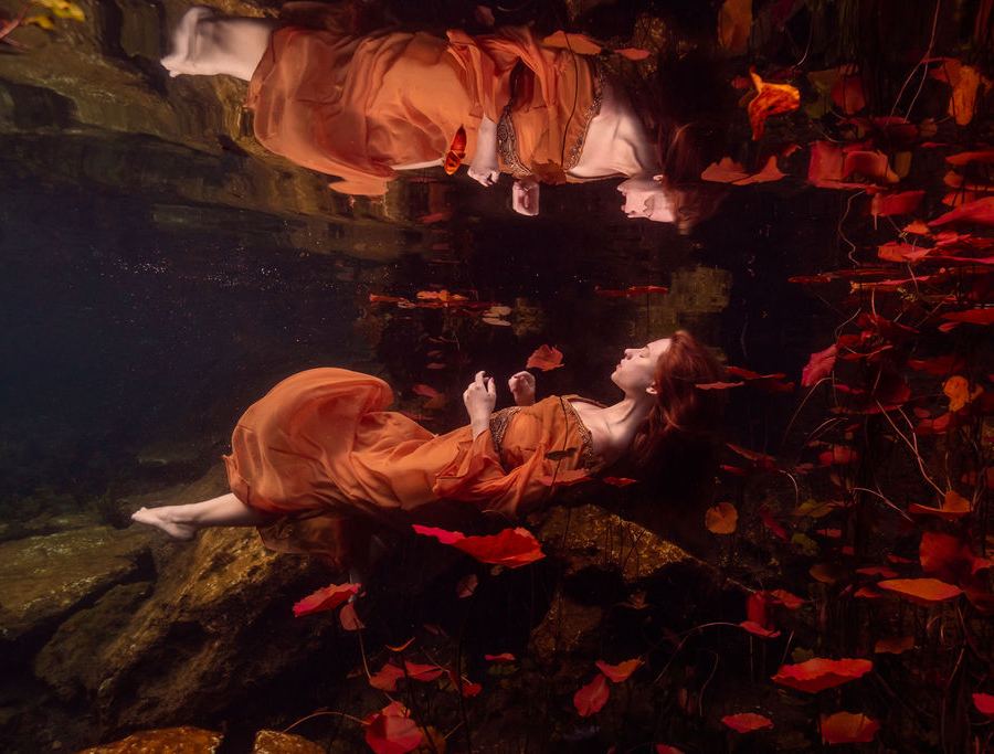 Underwater boudoir photoshoot with stained glass window backdrop
