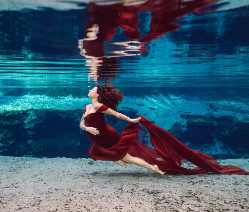 Expecting mother photographed underwater at a Florida spring