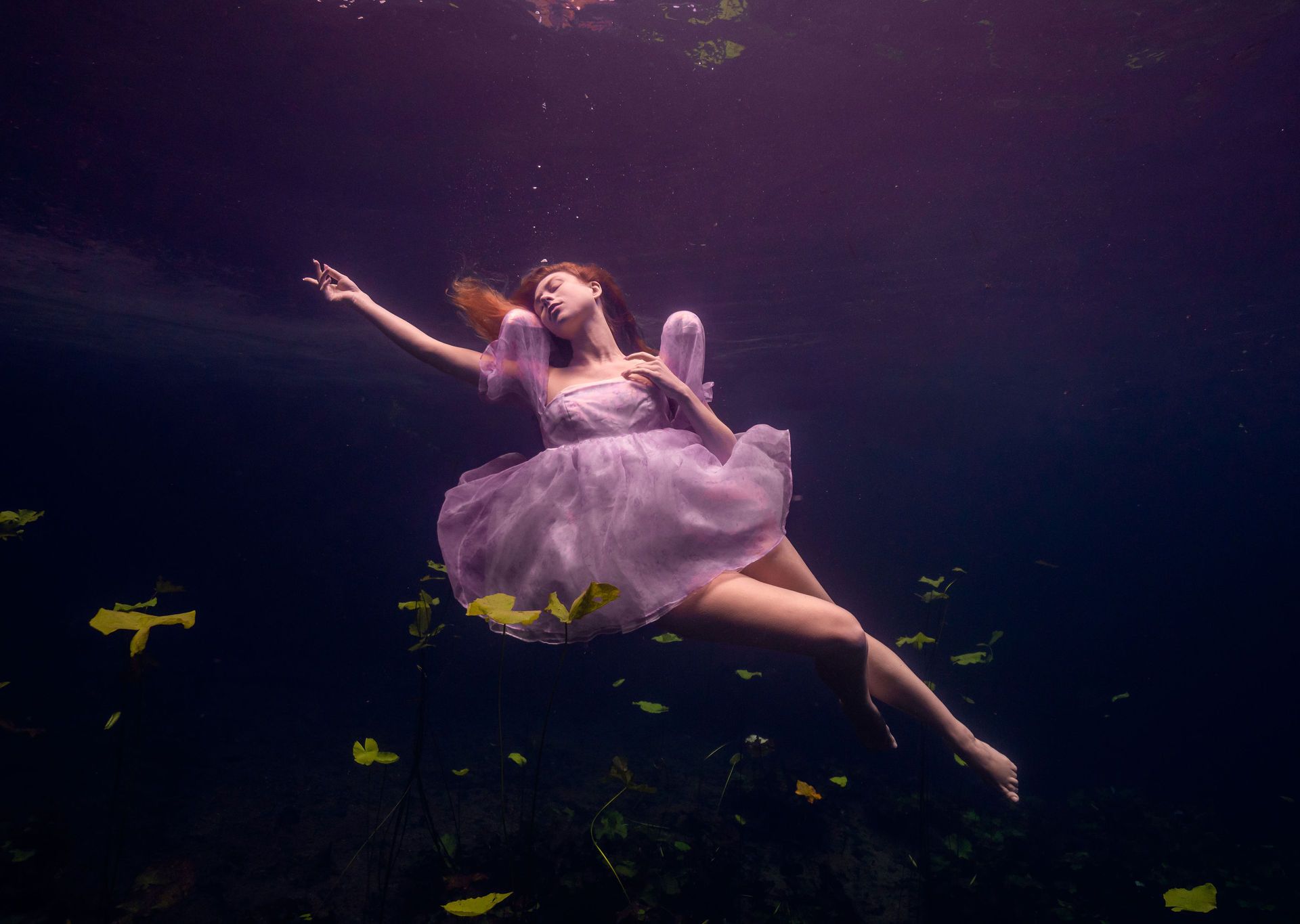 Underwater portrait in a lilac tulle gown at a Florida spring