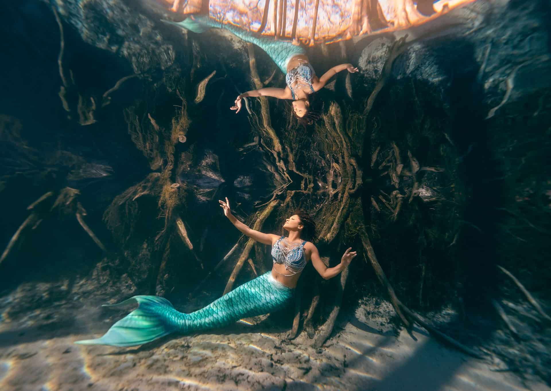 Model in a mermaid tail photographed underwater in a Florida spring