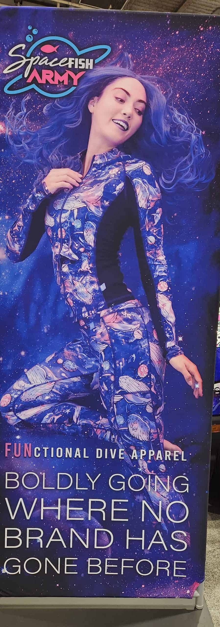 Banner of an underwater model wearing Spacefish Army apparel at the DEMA scuba show.