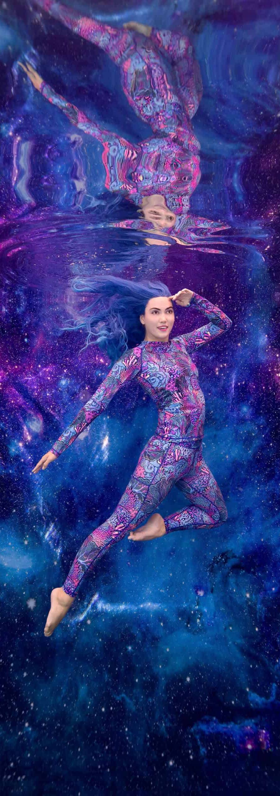 Photoshoot underwater for Spacefish Army clothing apparel with a model posing against a galaxy backdrop.